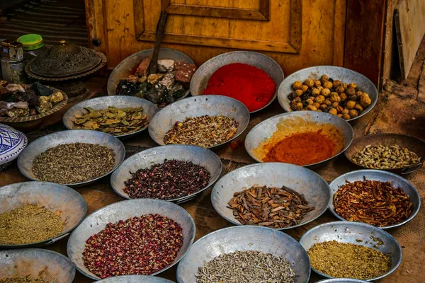 Colorful pyramids of aromatic spices displayed in Souk El Had market in Agadir