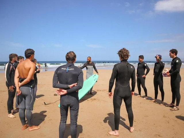 Jamal briefing a small group on the sand